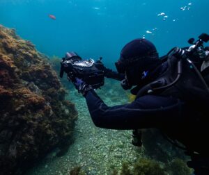 Diver operating the Gates Deep komodo Underwater Housing